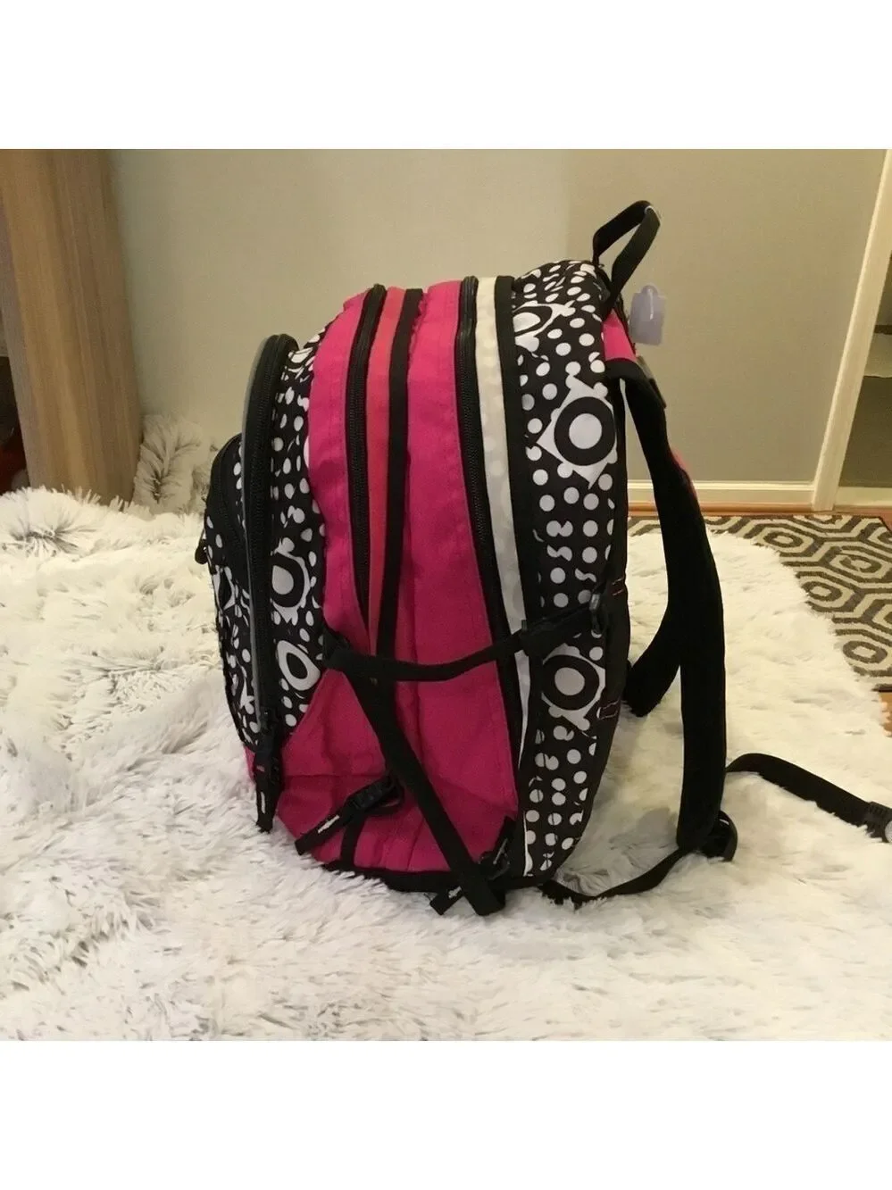 High Sierra pink black and White patterned backpack with suspension stra…